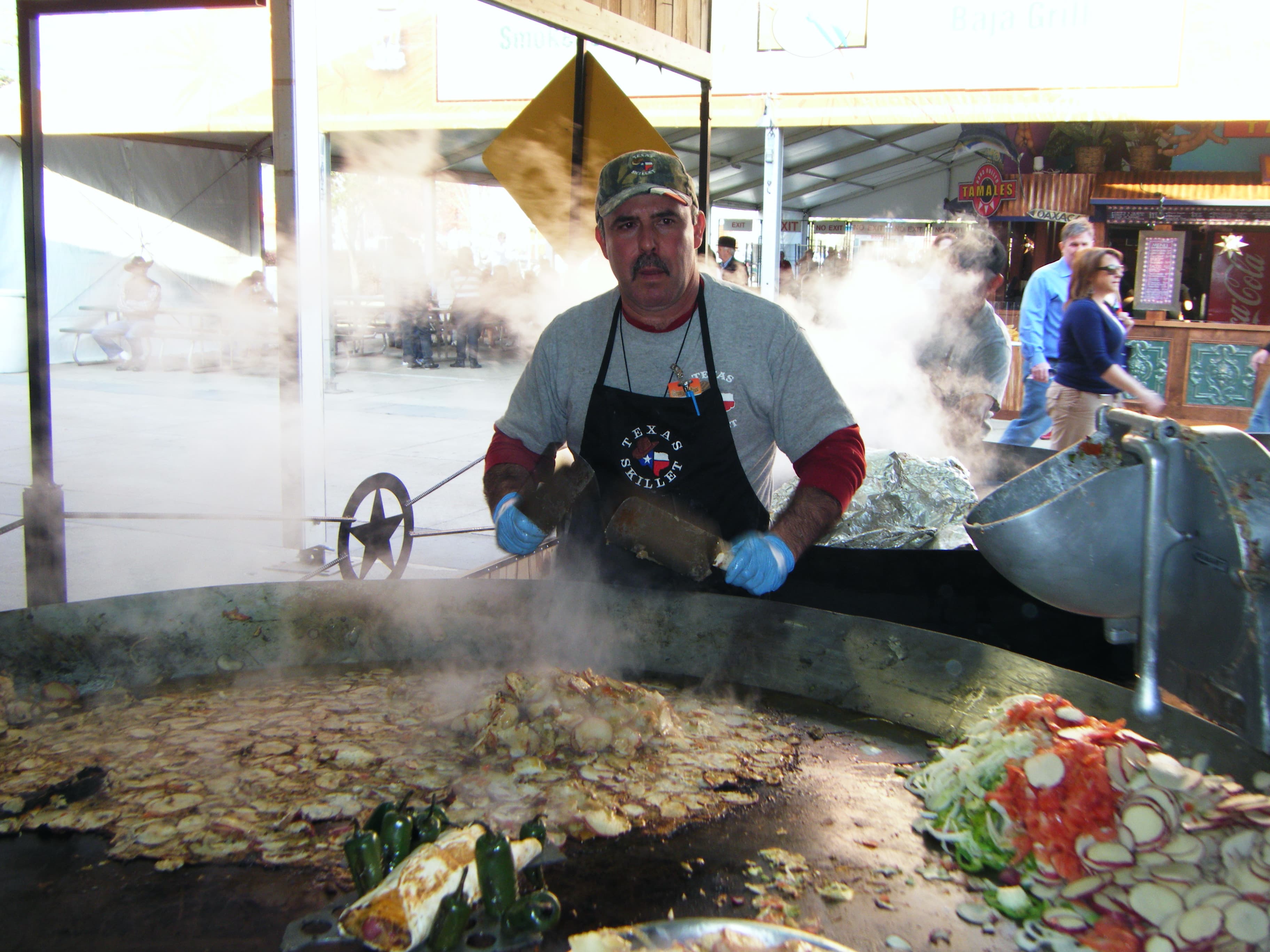 Skillet potatoes cooking on the flat-top griddle
